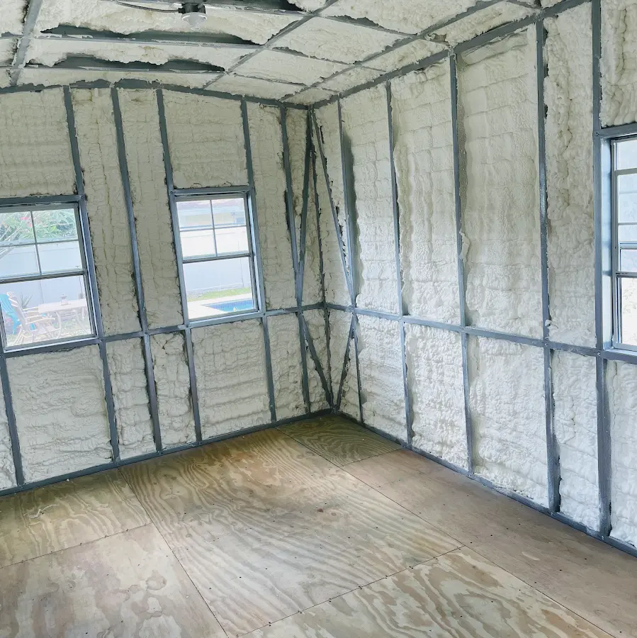 Closed-cell spray foam insulation applied to wall cavities in a residential project in Swanton